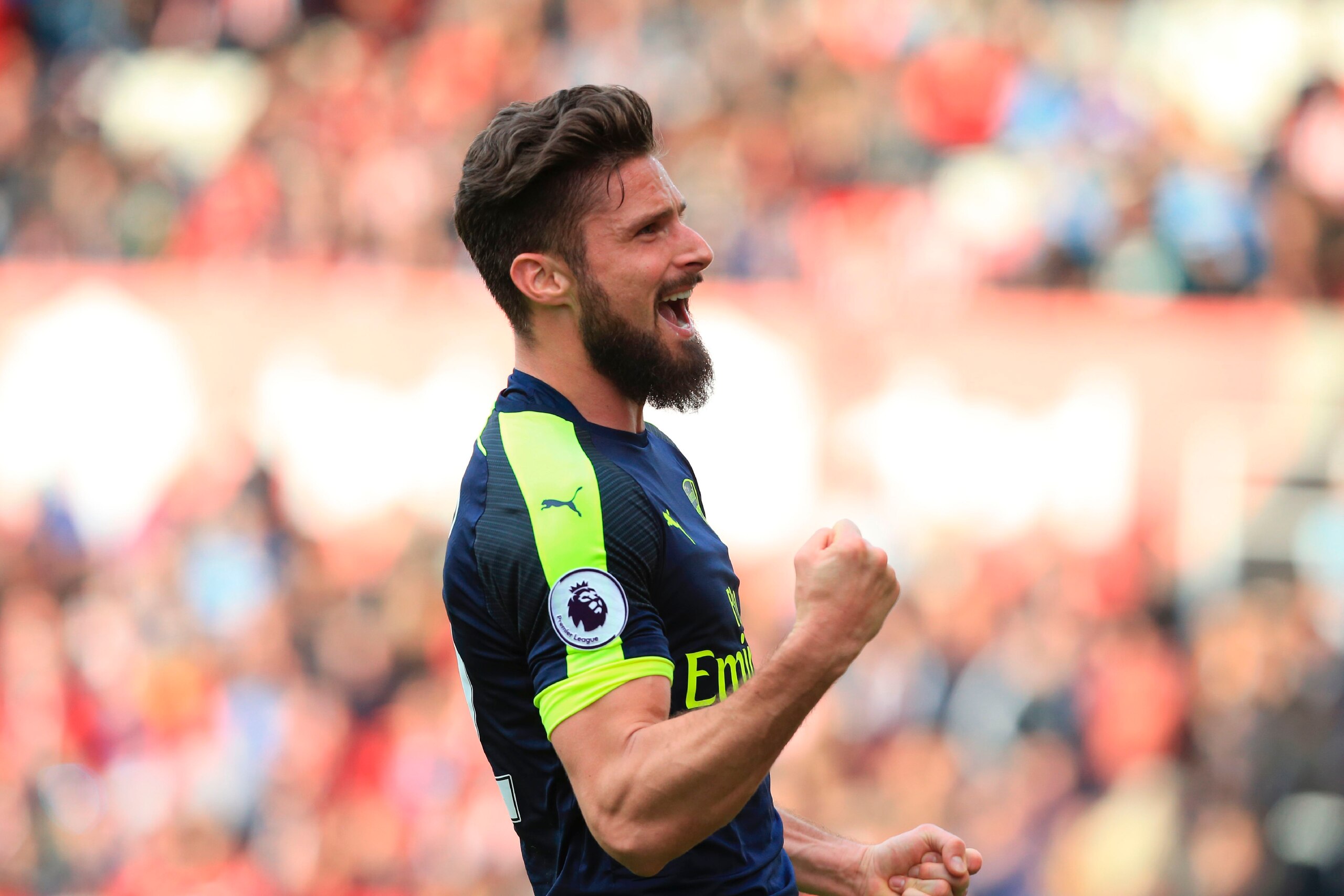 Arsenal's French striker Olivier Giroud celebrates after scoring their fourth goal during the English Premier League football match between Stoke City and Arsenal at the Bet365 Stadium in Stoke-on-Trent, central England on May 13, 2017.
Arsenal won the ga