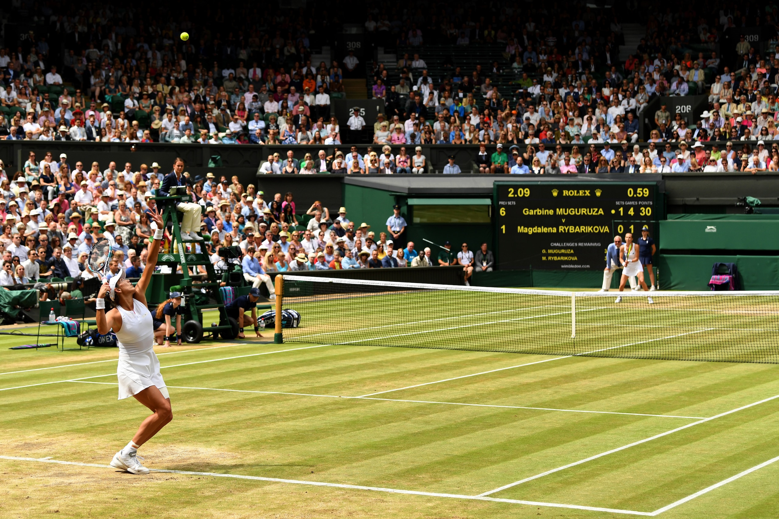 LONDON, ENGLAND - JULY 13:  Garbine Muguruza of Spain serves during the Ladies Singles semi final match against Magdalena Rybarikova of Slovakia on day ten of the Wimbledon Lawn Tennis Championships at the All England Lawn Tennis and Croquet Club at Wimbl