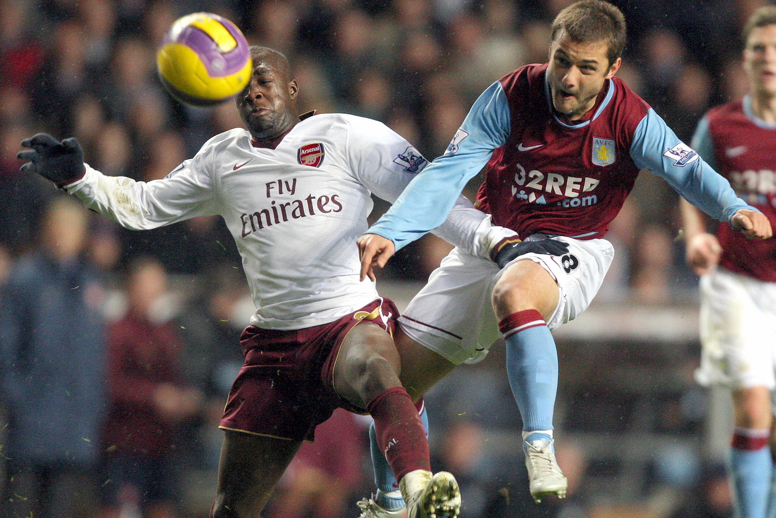Aston Villa's Shaun Maloney (R) fires a shot past Arsenal's Lassana Diarra during their Premier league football match at Villa Park, Birmingham, England, 01 December 2007.           AFP PHOTO / ANDREW YATES    Mobile and website use of domestic English fo