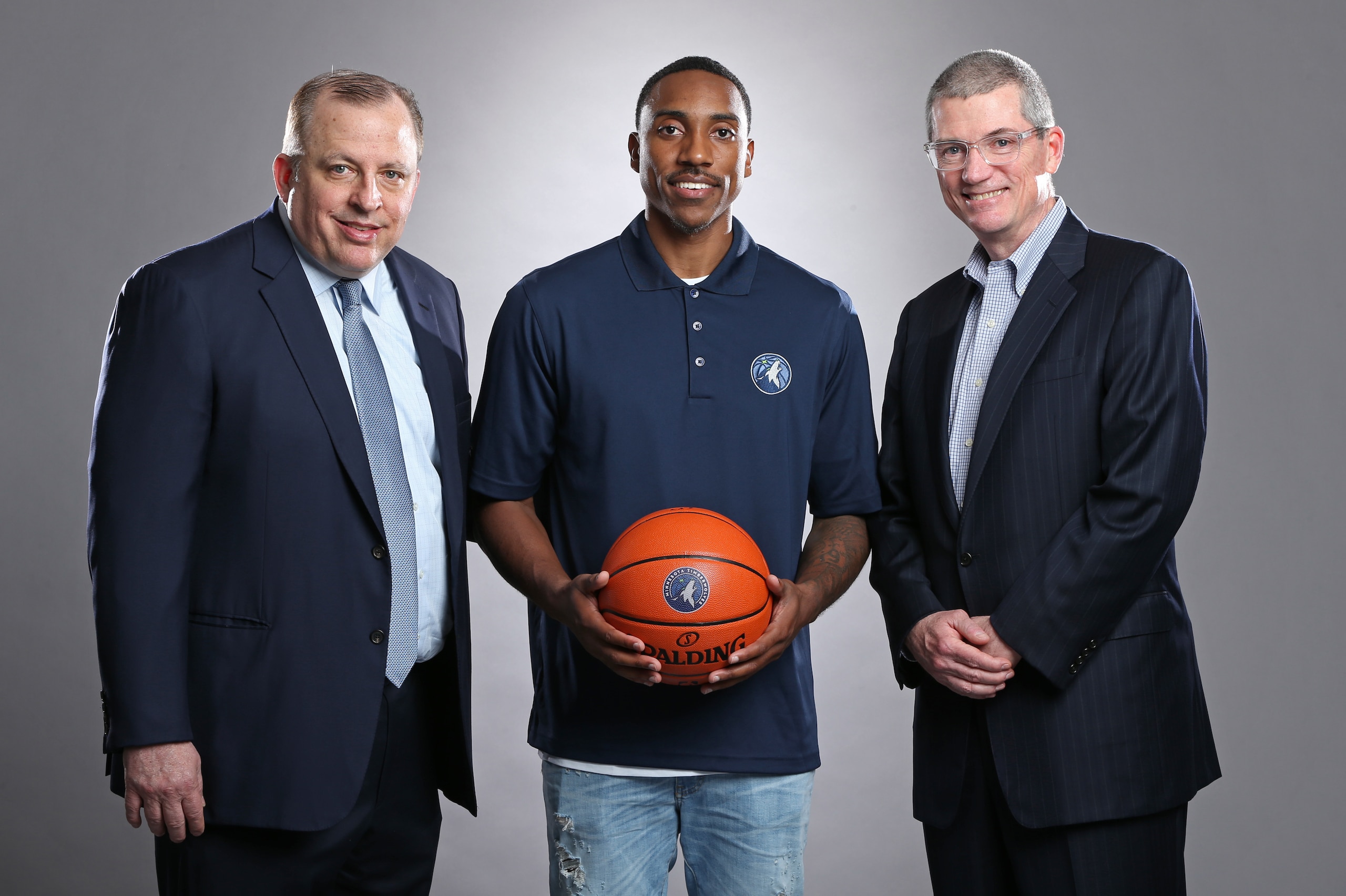 MINNEAPOLIS, MN - JULY 10:  Free Agent signee Jeff Teague of the Minnesota Timberwolves poses for portraits with Scott Layden and Tom Thibodeau on July 10, 2017 at the Minnesota Timberwolves and Lynx Courts at Mayo Clinic Square in Minneapolis, Minnesota.
