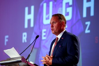 An embattled Freeze at the podium at SEC media days.