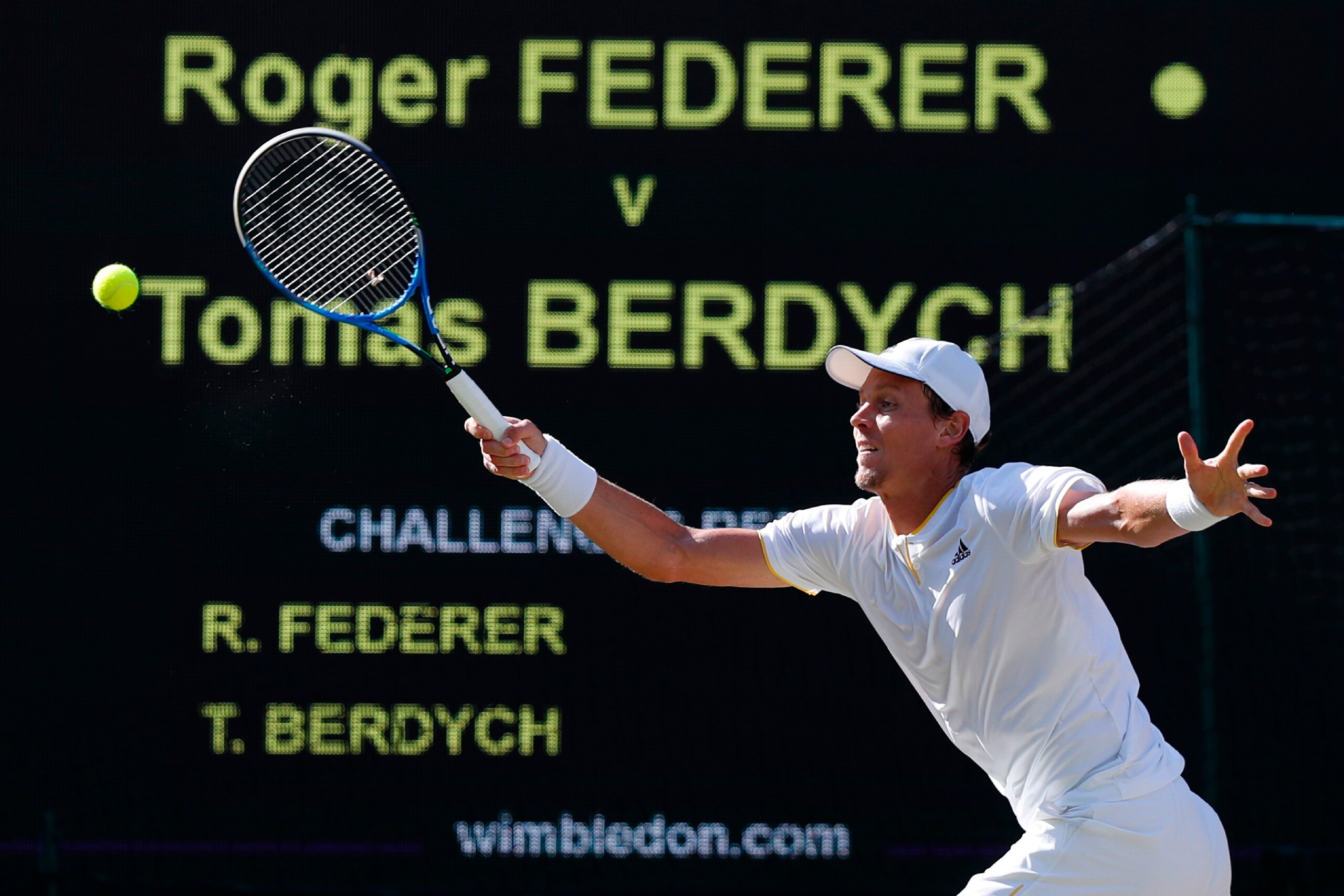 Czech Republic's Tomas Berdych returns against Switzerland's Roger Federer during their men's singles semi-final match on the eleventh day of the 2017 Wimbledon Championships at The All England Lawn Tennis Club in Wimbledon, southwest London, on July 14, 