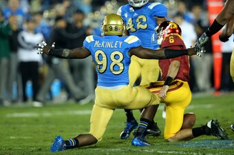 PASADENA, CA - NOVEMBER 22:  Takkarist McKinley #98 of the UCLA Bruins celebrates after sacking quarterback Cody Kessler #6 of the USC Trojans in the third quarter at the Rose Bowl on November 22, 2014 in Pasadena, California.   UCLA on 38-20.  (Photo by 
