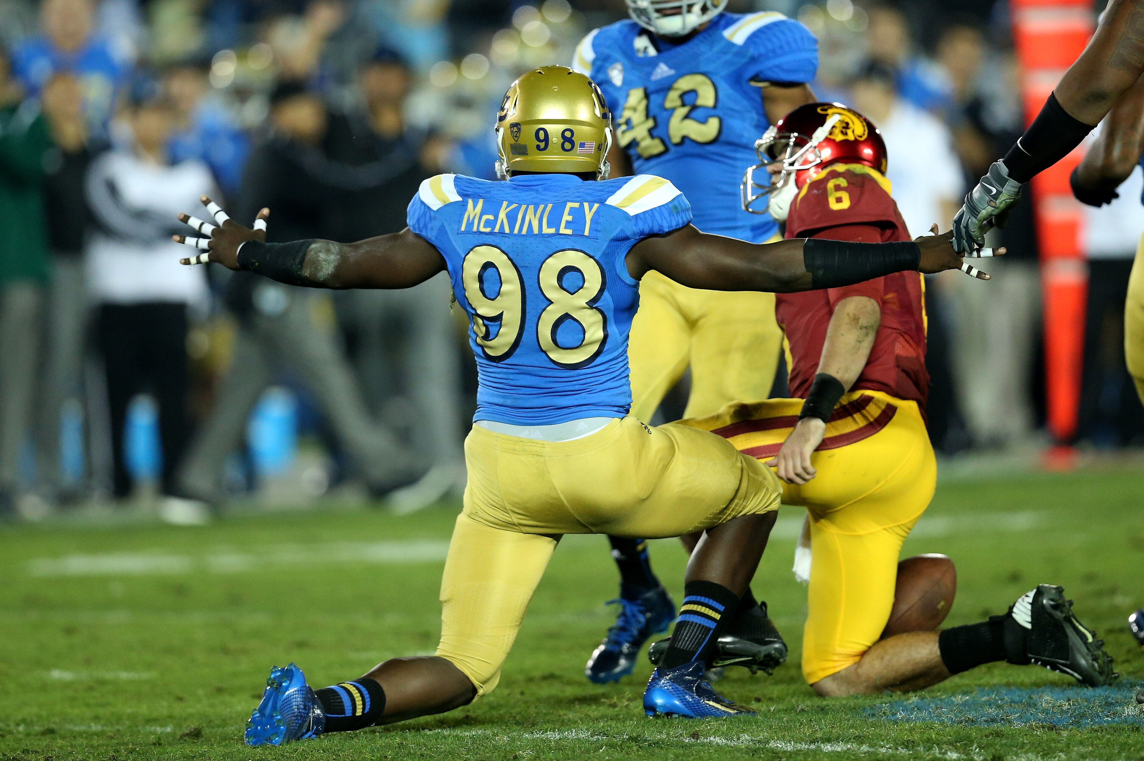 PASADENA, CA - NOVEMBER 22:  Takkarist McKinley #98 of the UCLA Bruins celebrates after sacking quarterback Cody Kessler #6 of the USC Trojans in the third quarter at the Rose Bowl on November 22, 2014 in Pasadena, California.   UCLA on 38-20.  (Photo by 