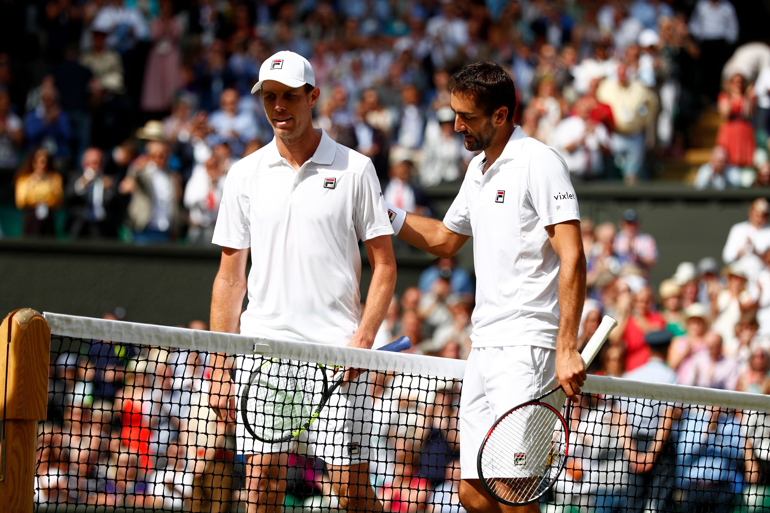 LONDON, ENGLAND - JULY 14:  Marin Cilic of Croatia and Sam Querrey of The United States shake hands after the Gentlemen's Singles semi final match on day eleven of the Wimbledon Lawn Tennis Championships at the All England Lawn Tennis and Croquet Club at 