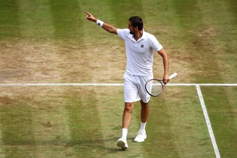 LONDON, ENGLAND - JULY 14:  Marin Cilic of Croatia celebrates victory after the Gentlemen's Singles semi final match against Sam Querrey of The United States on day eleven of the Wimbledon Lawn Tennis Championships at the All England Lawn Tennis and Croqu