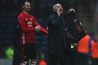 BLACKBURN, ENGLAND - FEBRUARY 19: Zlatan Ibrahimovic of Manchester United prepares to enter the field as manager Jose Mourinho gives instructions during the Emirates FA Cup Fifth Round match between Blackburn Rovers and Manchester United at Ewood Park on 
