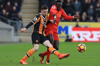 Liverpool's Senegalese midfielder Sadio Mane (R) vies with Hull City's Scottish defender Andrew Robertson (L) during the English Premier League football match between Hull City and Liverpool at the KCOM Stadium in Kingston upon Hull, north east England on