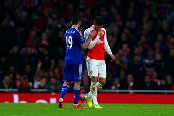 LONDON, ENGLAND - JANUARY 24:  Diego Costa of Chelsea consoles Olivier Giroud of Arsenal as he reacts to being substituted during the Barclays Premier League match between Arsenal and Chelsea at Emirates Stadium on January 24, 2016 in London, England.  (P