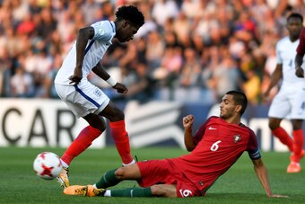 TBILISI, GEORGIA - JULY 15:  Isaac Buckley-Ricketts of England is tackled by Rui Pires of Portugal during the UEFA European Under-19 Championship Final between England and Portugal on July 15, 2017 in Gori, Georgia.  (Photo by Levan Verdzeuli/Getty Images