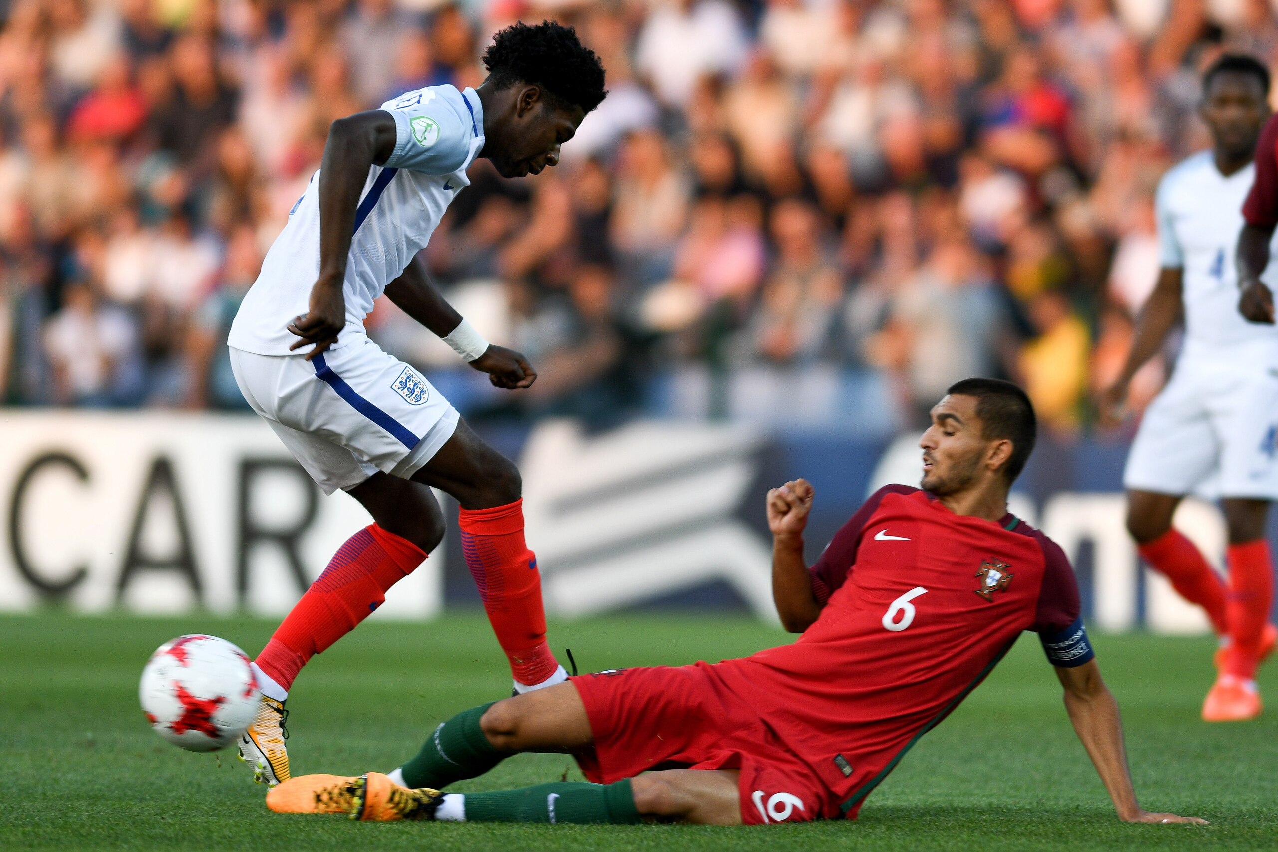 TBILISI, GEORGIA - JULY 15: Isaac Buckley-Ricketts of England is tackled by Rui Pires of Portugal during the UEFA European Under-19 Championship Final between England and Portugal on July 15, 2017 in Gori, Georgia. (Photo by Levan Verdzeuli/Getty Images TBILISI, GEORGIA - JULY 15: Isaac Buckley-Ricketts of England is tackled by Rui Pires of Portugal during the UEFA European Under-19 Championship Final between England and Portugal on July 15, 2017 in Gori, Georgia. (Photo by Levan Verdzeuli/Getty Images