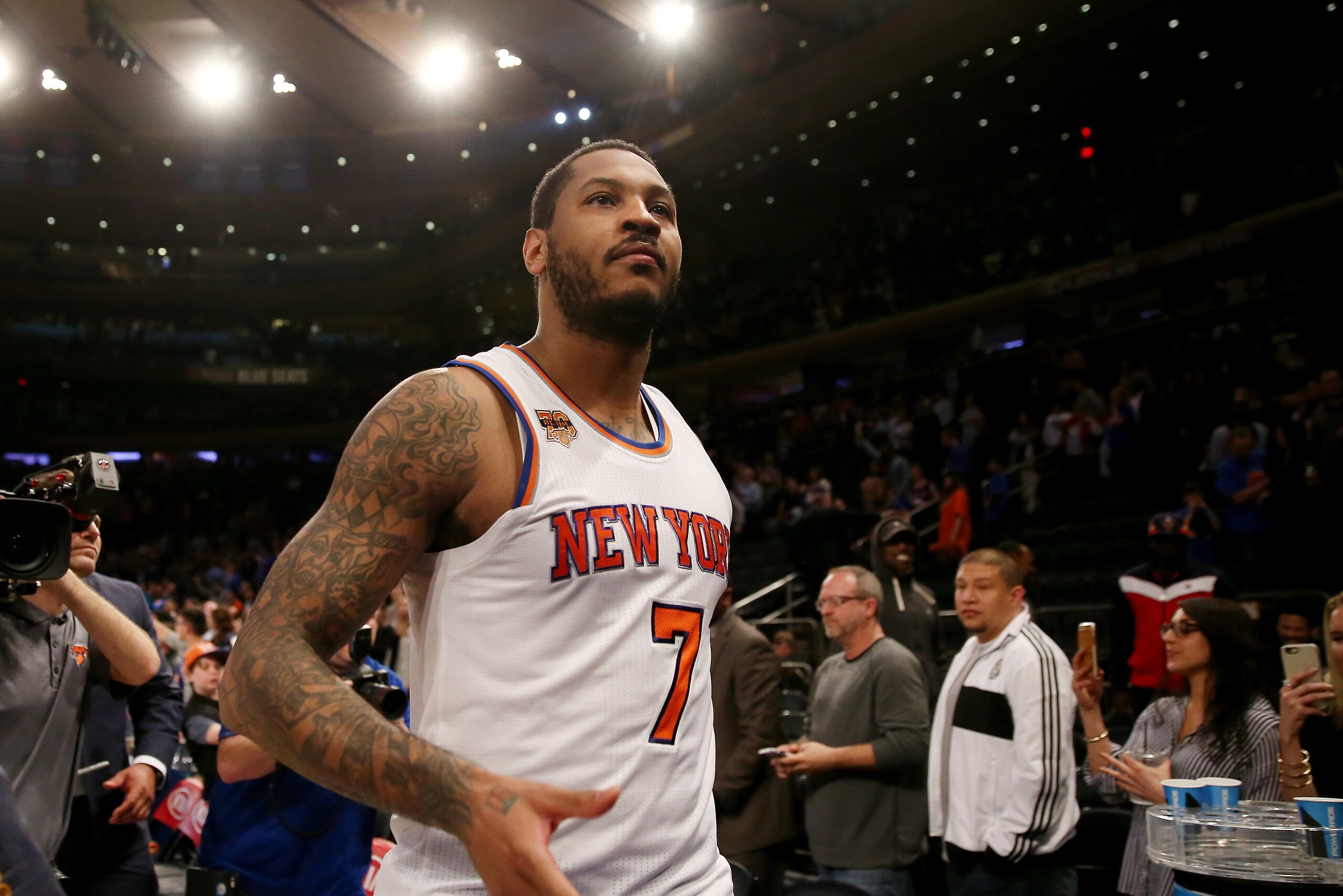 NEW YORK, NY - APRIL 12:  Carmelo Anthony #7 of the New York Knicks walks off the court after the 114-113 win over the Philadelphia 76ers at Madison Square Garden on April 12, 2017 in New York City. NOTE TO USER: User expressly acknowledges and agrees tha