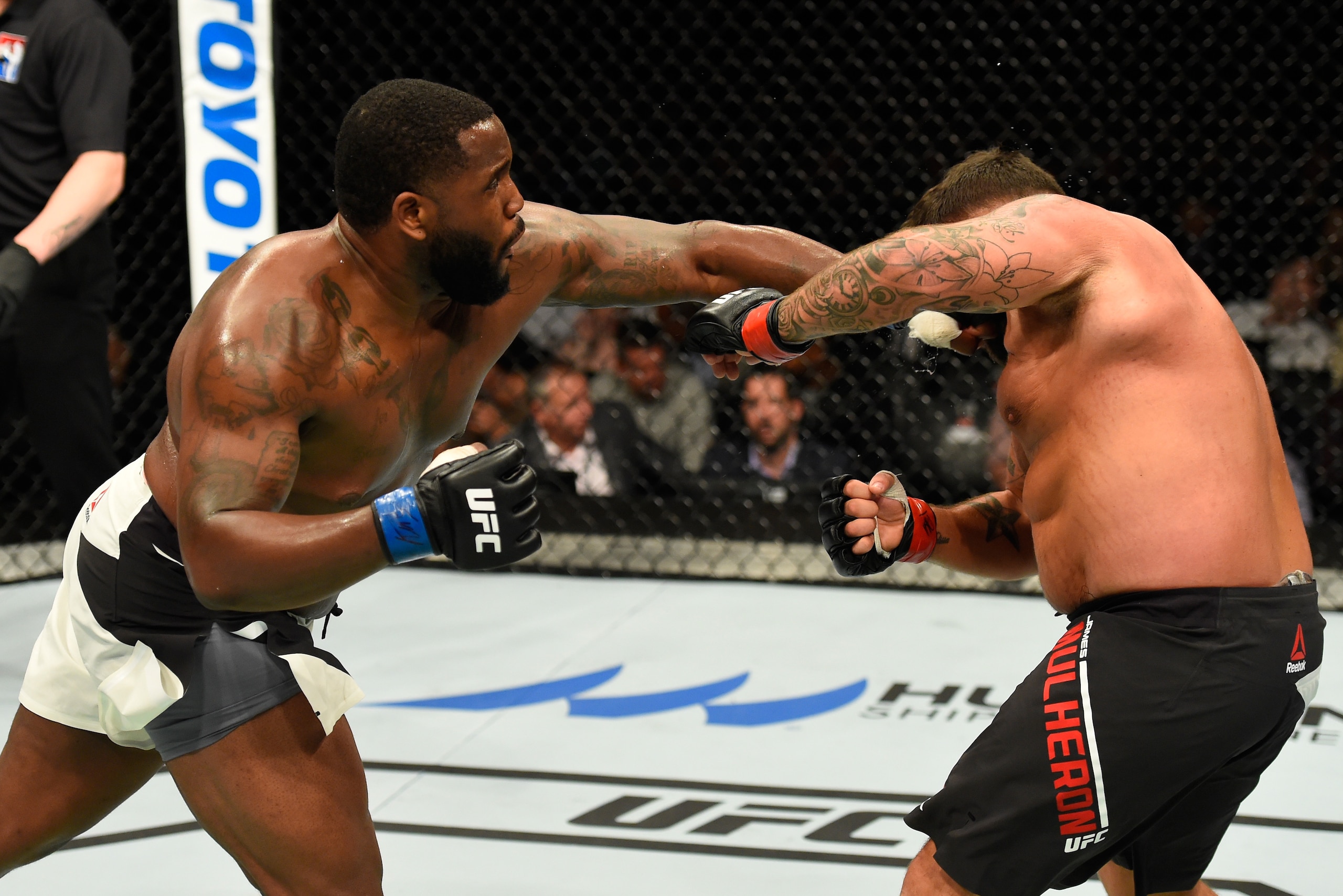 GLASGOW, SCOTLAND - JULY 16:  (L-R) Justin Willis punches James Mulheron of England in their heavyweight bout during the UFC Fight Night event at the SSE Hydro Arena Glasgow on July 16, 2017 in Glasgow, Scotland. (Photo by Josh Hedges/Zuffa LLC/Zuffa LLC 