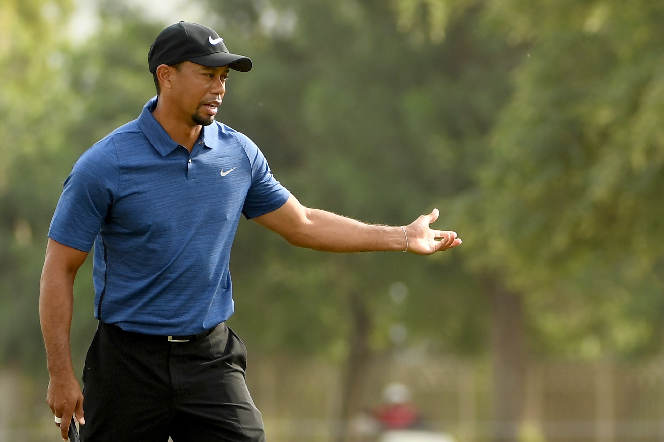 DUBAI, UNITED ARAB EMIRATES - FEBRUARY 02:  Tiger Woods of the USA reacts to his putt on 15th hole during the first round of the Omega Dubai Desert Classic at Emirates Golf Club on February 2, 2017 in Dubai, United Arab Emirates.  (Photo by Ross Kinnaird/