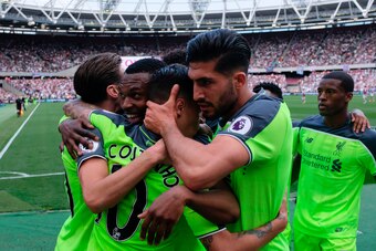Liverpool's Brazilian midfielder Philippe Coutinho (C) celebrates with teammates Liverpool's German midfielder Emre Can (R) and Liverpool's English striker Daniel Sturridge (2L) after he scored their second goal during the English Premier League football 
