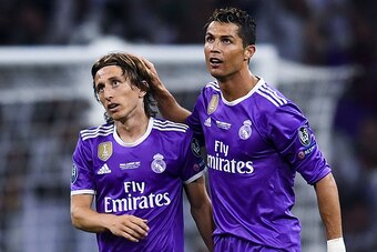 CARDIFF, WALES - JUNE 03:  Cristiano Ronaldo (R) of Real Madrid CF celebrates with his team mate Luka Modric after scoring his team's third goal during the UEFA Champions League Final between Juventus and Real Madrid at National Stadium of Wales on June 3