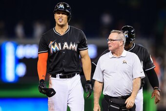 MIAMI, FL - AUGUST 13: Giancarlo Stanton #27 of the Miami Marlins walks off the field injured after the last play of the game against the Chicago White Sox at Marlins Park on August 13, 2016 in Miami, Florida. (Photo by Rob Foldy/Getty Images)