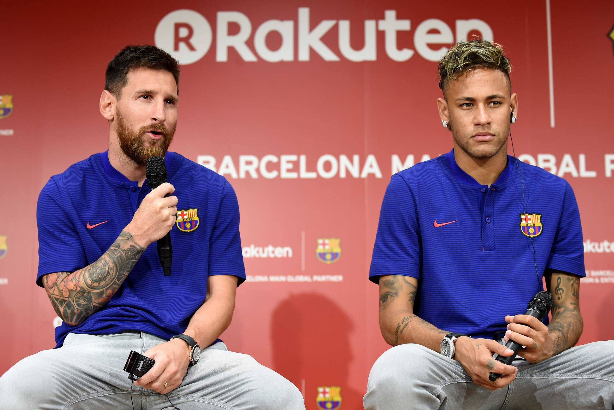 FC Barcelona football star Lionel Messi (L) answers questions beside teammate Neymar (R) during a press conference to announce new sponsorship with Japanese internet retailer Rakuten in Tokyo on July 13, 2017.
Japan's major internet retailer Rakuten enter FC Barcelona football star Lionel Messi (L) answers questions beside teammate Neymar (R) during a press conference to announce new sponsorship with Japanese internet retailer Rakuten in Tokyo on July 13, 2017.
Japan's major internet retailer Rakuten enter