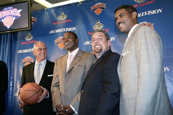 NEW YORK - JULY 28:  (L to R) Larry Brown, newly named head coach of the New York Knicks, Isiah Thomas, President of Basketball Operations, Knicks owner James Dolan and Steve Mills, president and chief operating officer, MSG Sports, stand together during 