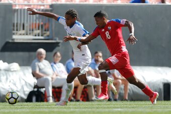 Martinique's Jean-Manuel Nedra (L) and Panama's Miguel Camargo chase a loose ball during the first half of a CONCACAF Gold Cup soccer match in Cleveland, Ohio on July 15, 2017. / AFP PHOTO / Jay LaPrete        (Photo credit should read JAY LAPRETE/AFP/Get