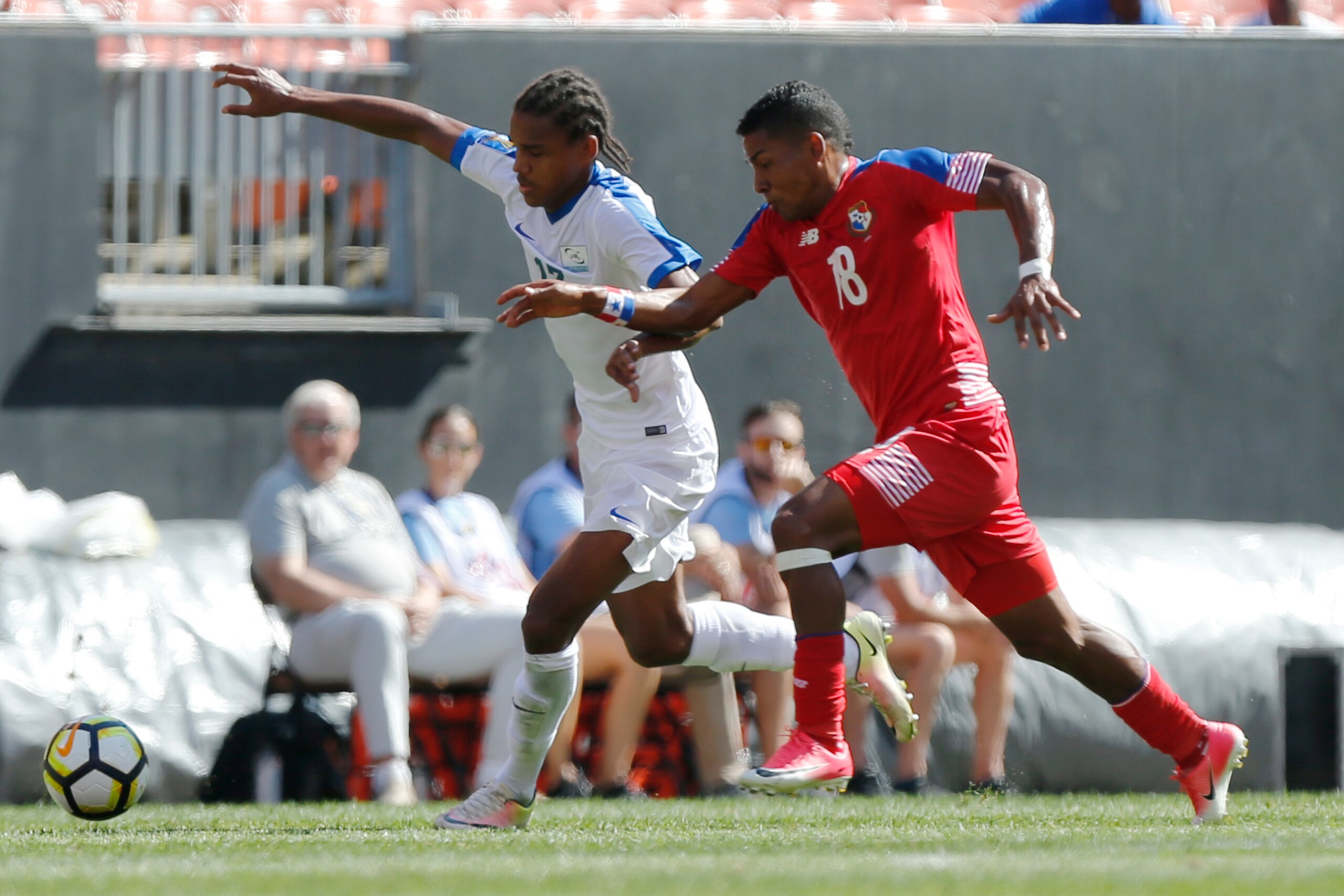 Martinique's Jean-Manuel Nedra (L) and Panama's Miguel Camargo chase a loose ball during the first half of a CONCACAF Gold Cup soccer match in Cleveland, Ohio on July 15, 2017. / AFP PHOTO / Jay LaPrete        (Photo credit should read JAY LAPRETE/AFP/Get