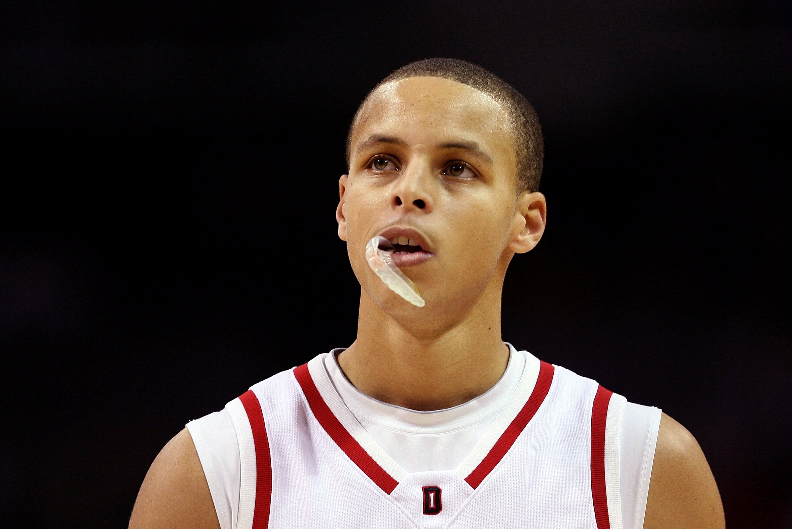 CHARLOTTE, NC - DECEMBER 06:  Stephen Curry #30 of the Davidson Wildcats watches on during their game against the North Carolina State Wolfpack at Time Warner Cable Arena on December 6, 2008 in Charlotte, North Carolina.  (Photo by Streeter Lecka/Getty Im