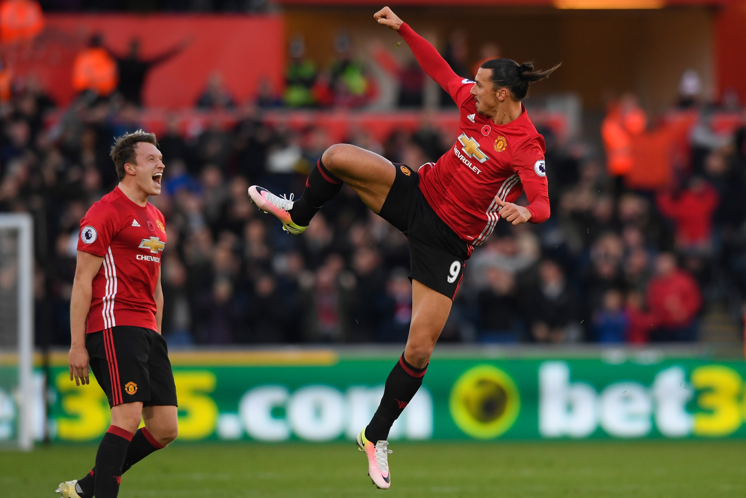 SWANSEA, WALES - NOVEMBER 06:  Zlatan Ibrahimovic of Manchester United celebrates scoring his sides second goal with Phil Jones of Manchester United during the Premier League match between Swansea City and Manchester United at Liberty Stadium on November 