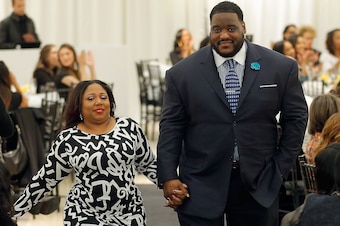 NEW YORK, NY - JANUARY 31:  Nicole Woody and Damien Woody walk the runway at the Saks Fifth Avenue And Off The Field Players' Wives Association Charitable Fashion Show on January 31, 2014 in New York City.  (Photo by Jemal Countess/Getty Images for Saks F