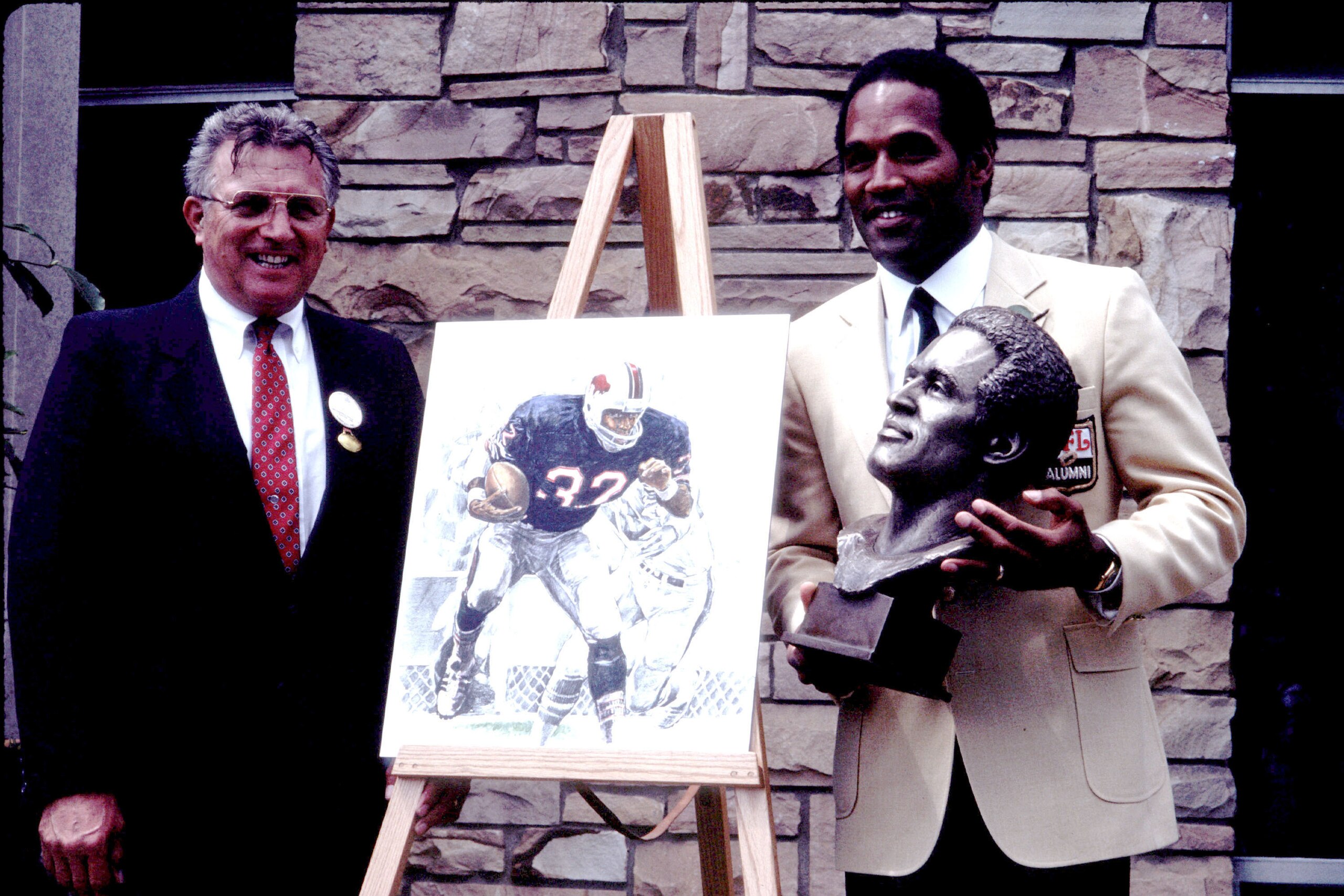 Coach Lou Sabin and O.J. Simpson (Photo by Kevin Reece/Getty Images) Coach Lou Sabin and O.J. Simpson (Photo by Kevin Reece/Getty Images)