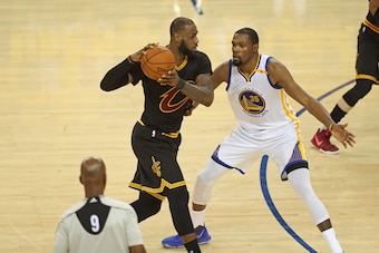 OAKLAND, CA - JUNE 12:  Kevin Durant #35 of the Golden State Warriors guards LeBron James #23 of the Cleveland Cavaliers in Game Five of the 2017 NBA Finals on June 12, 2017 at Oracle Arena in Oakland, California. NOTE TO USER: User expressly acknowledges