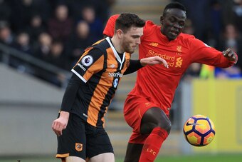 Liverpool's Senegalese midfielder Sadio Mane (R) vies with Hull City's Scottish defender Andrew Robertson (L) during the English Premier League football match between Hull City and Liverpool at the KCOM Stadium in Kingston upon Hull, north east England on