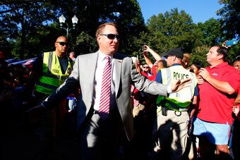 OXFORD, MS - OCTOBER 29:   Mississippi Rebels head coach Hugh Freeze greets fans as they walk down the Walk of Champions in the Grove before an NCAA college football game against the Auburn Tigers on October 29, 2016 in Oxford, Mississippi. (Photo by Butc