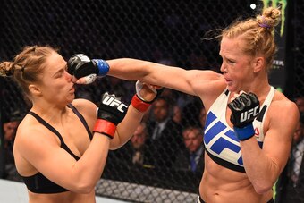 MELBOURNE, AUSTRALIA - NOVEMBER 15:  (R-L) Holly Holm of the United States punches Ronda Rousey of the United States in their UFC women's bantamweight championship bout during the UFC 193 event at Etihad Stadium on November 15, 2015 in Melbourne, Australi