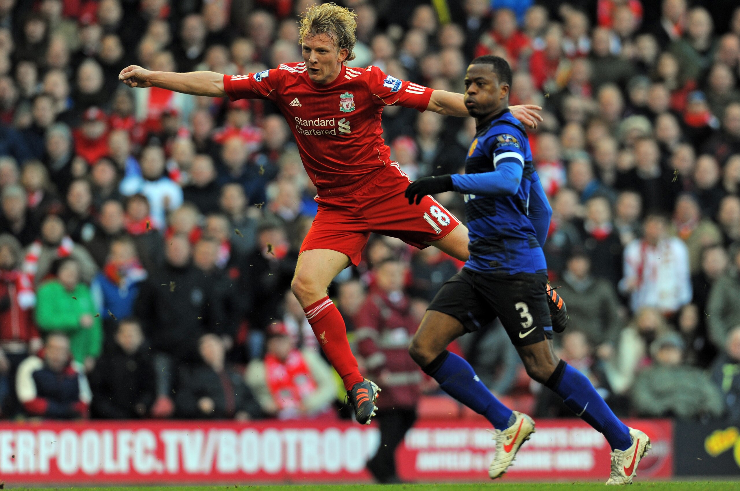 Liverpool's Dutch striker Dirk Kuyt (L) scores their winning goal watched by Manchester United's French defender Patrice Evra (R) during the English FA Cup fourth round football match between Liverpool and Manchester United at Anfield in Liverpool, north- Liverpool's Dutch striker Dirk Kuyt (L) scores their winning goal watched by Manchester United's French defender Patrice Evra (R) during the English FA Cup fourth round football match between Liverpool and Manchester United at Anfield in Liverpool, north-