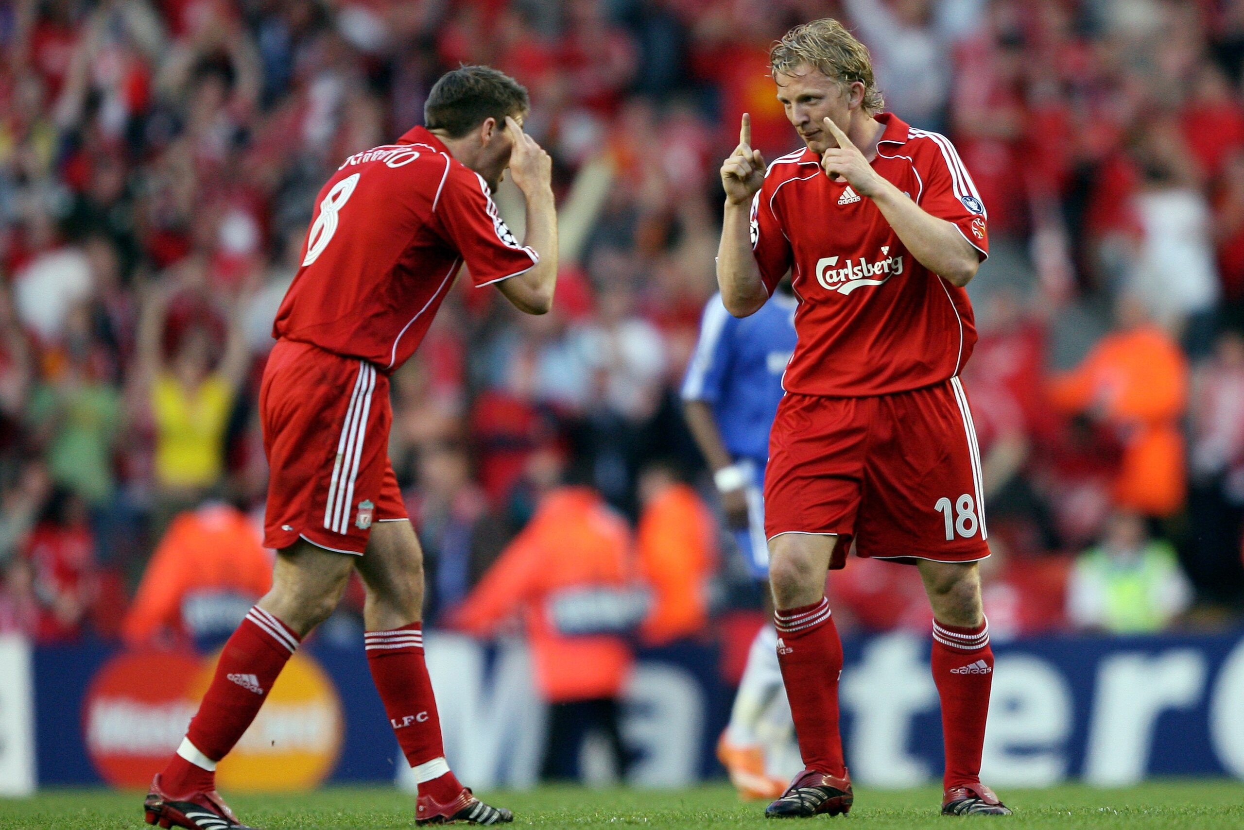 LIVERPOOL, UNITED KINGDOM - MAY 01: Steven Gerrard (L) and Dirk Kuyt (R) of Liverpool talk to each other after team mate Daniel Agger scores the first goal of the game during the UEFA Champions League semi final second leg match between Liverpool and Che LIVERPOOL, UNITED KINGDOM - MAY 01: Steven Gerrard (L) and Dirk Kuyt (R) of Liverpool talk to each other after team mate Daniel Agger scores the first goal of the game during the UEFA Champions League semi final second leg match between Liverpool and Che