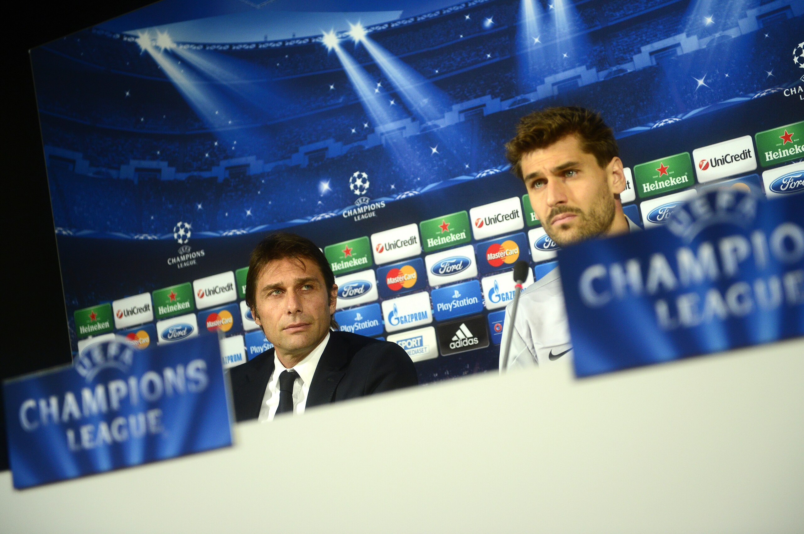 Juventus' Spanish foward Fernando Torres Llorente (R) and Juventus' coach Antonio Conte answer journalists during a press conference on the eve of the UEFA Champions League group B football match Juventus vs Copenhagen, on November 26, 2013 at their train Juventus' Spanish foward Fernando Torres Llorente (R) and Juventus' coach Antonio Conte answer journalists during a press conference on the eve of the UEFA Champions League group B football match Juventus vs Copenhagen, on November 26, 2013 at their train