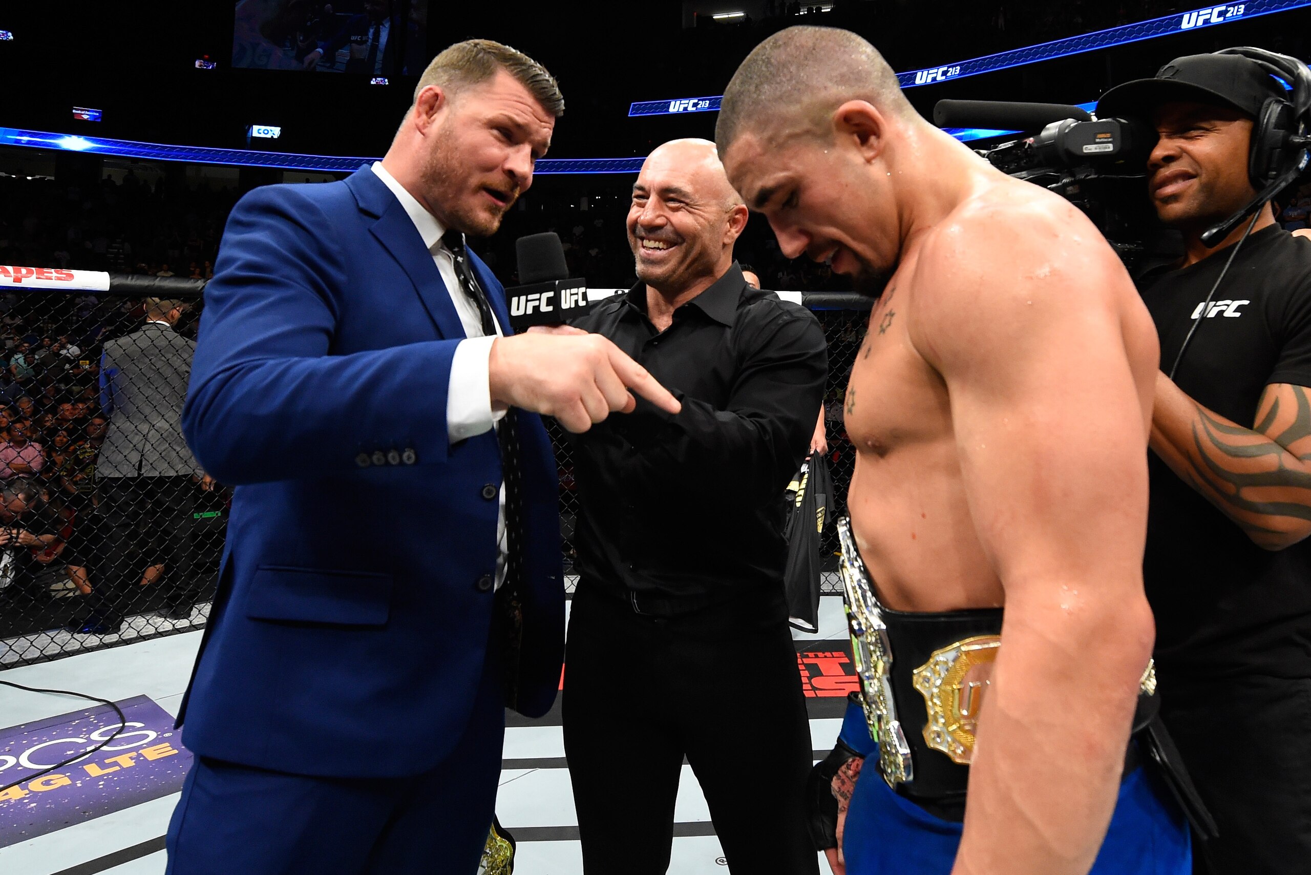LAS VEGAS, NV - JULY 08:  (L-R) UFC middleweight champion Michael Bisping challenges newly crowned interim UFC middleweight champion Robert Whittaker of New Zealand after his victory over Yoel Romero during the UFC 213 event at T-Mobile Arena on July 8, 2