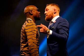 LONDON, ENGLAND - JULY 14:  (R-L) Conor McGregor and Floyd Mayweather Jr. face off during the Floyd Mayweather Jr. v Conor McGregor World Press Tour event at SSE Arena on July 14, 2017 in London, England. (Photo by Jeff Bottari/Zuffa LLC/Zuffa LLC via Get
