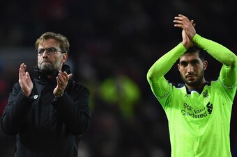 MANCHESTER, ENGLAND - JANUARY 15:  Jurgen Klopp manager of Liverpool and Emre Can of Liverpool applaud the travelling fans after the Premier League match between Manchester United and Liverpool at Old Trafford on January 15, 2017 in Manchester, England.  