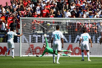 SANTA CLARA, CA - JULY 23:  Carlos Henrique Casemiro #14 of Real Madrid scores on a penalty kick past goalie David De Gea #1 of Manchester United during the International Champions Cup match at Levi's Stadium on July 23, 2017 in Santa Clara, California.  