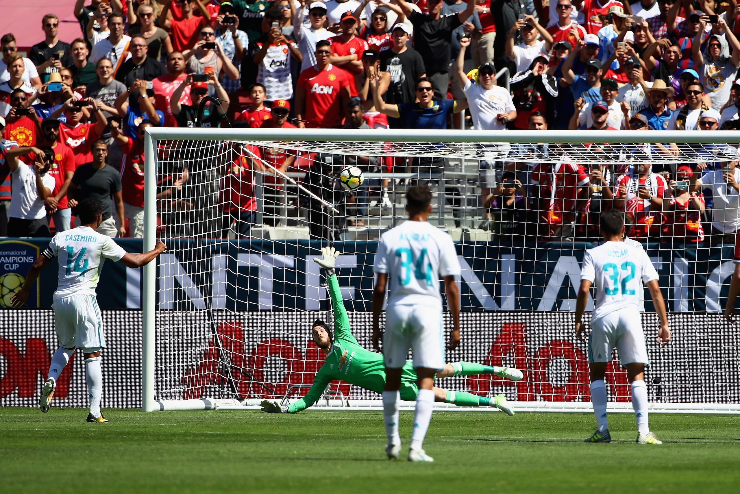 SANTA CLARA, CA - JULY 23:  Carlos Henrique Casemiro #14 of Real Madrid scores on a penalty kick past goalie David De Gea #1 of Manchester United during the International Champions Cup match at Levi's Stadium on July 23, 2017 in Santa Clara, California.  