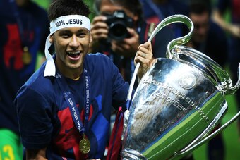 BERLIN, GERMANY - JUNE 06:  Neymar Jr of Barcelona lifts the trophy during the UEFA Champions League Final between Barcelona and Juventus at Olympiastadion on June 6, 2015 in Berlin, Germany. (Photo by Ian MacNicol/Getty Images)