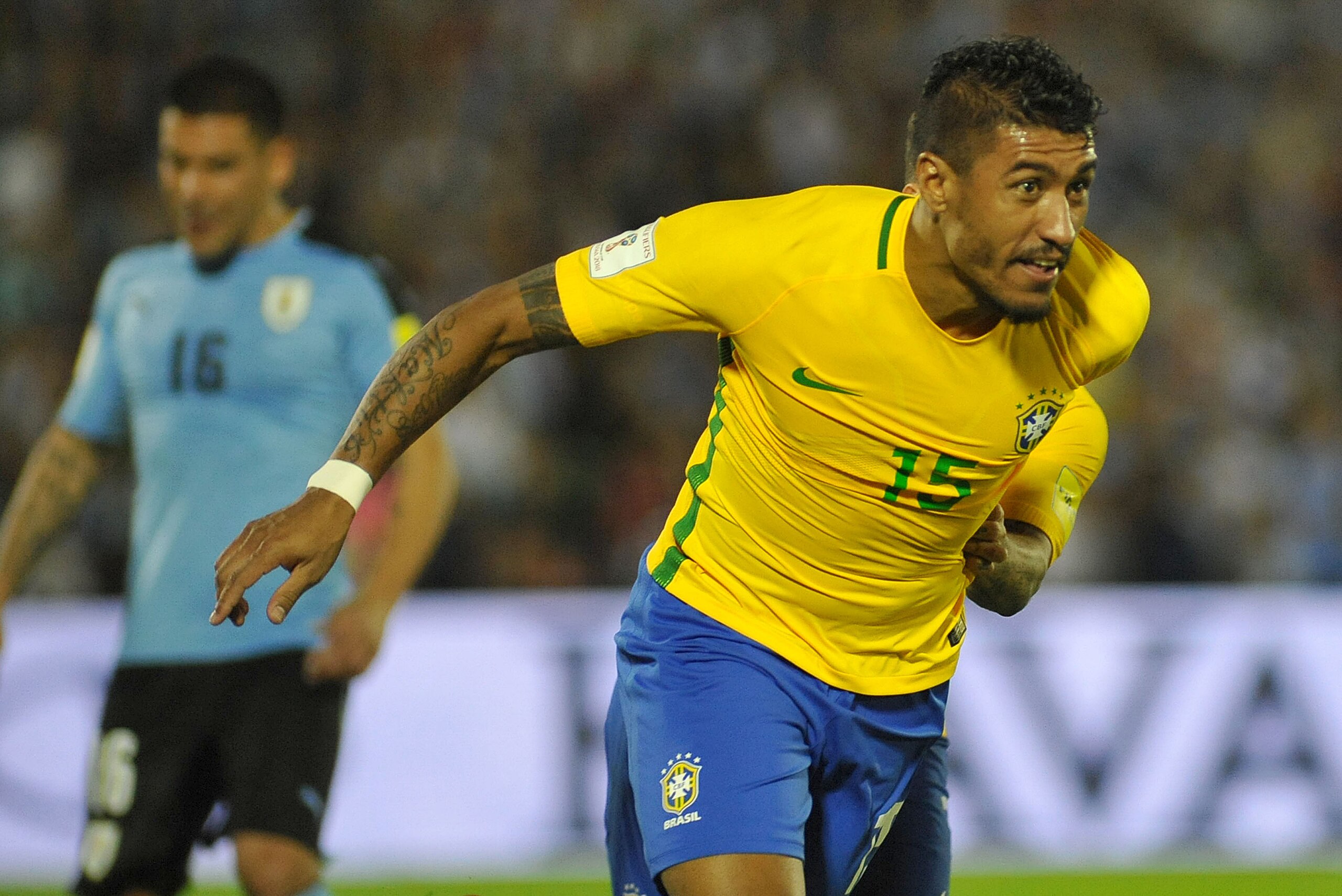 Brazil's midfielder Paulinho celebrates his second goal during their 2018 FIFA World Cup qualifier football match against Uruguay at the Centenario stadium in Montevideo, on March 23, 2017. / AFP PHOTO / DANTE FERNANDEZ        (Photo credit should read DA