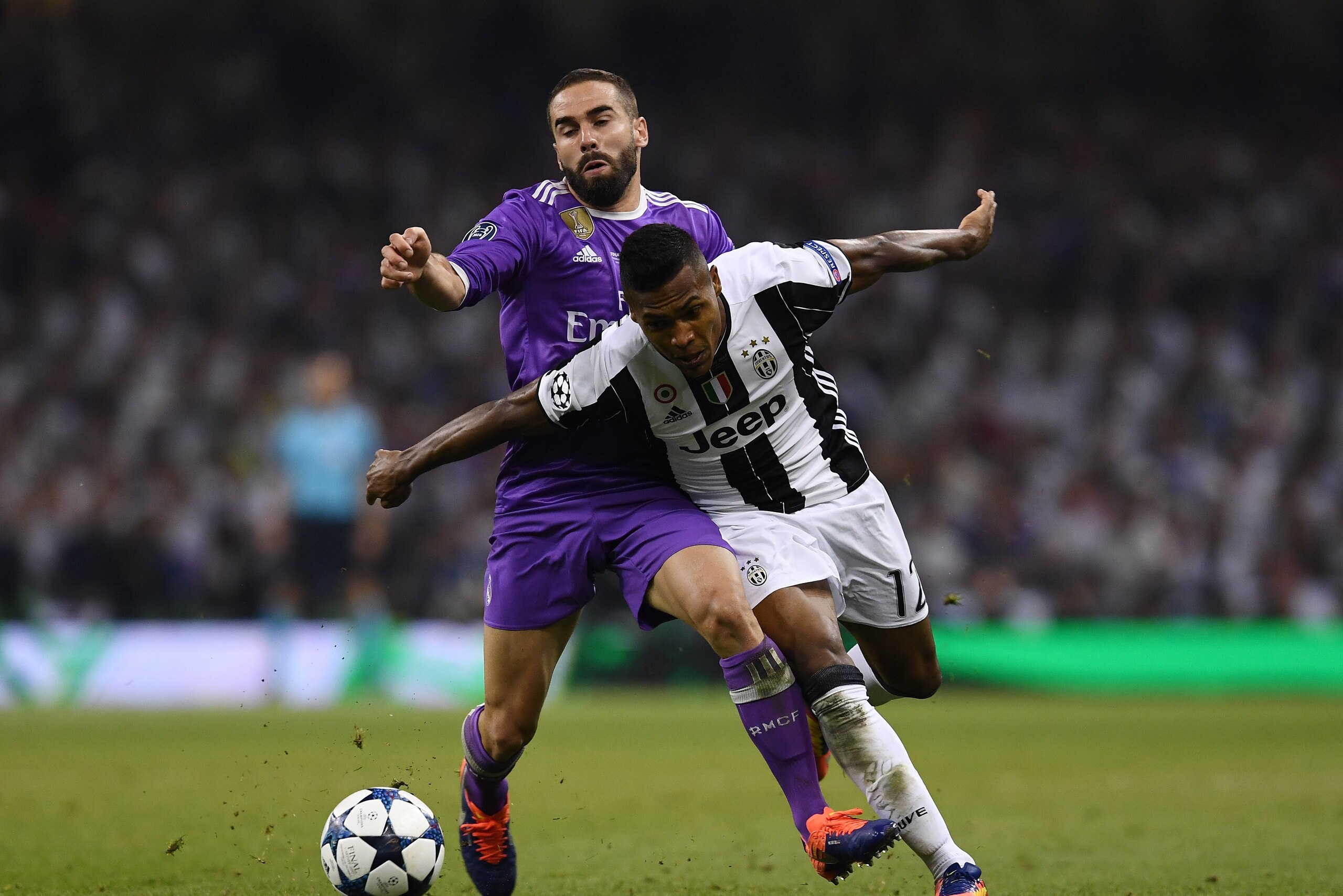 CARDIFF, WALES - JUNE 03: Daniel Carvajal of Real Madrid and Alex Sandro of Juventus battle for possession during the UEFA Champions League Final between Juventus and Real Madrid at National Stadium of Wales on June 3, 2017 in Cardiff, Wales.  (Photo by D