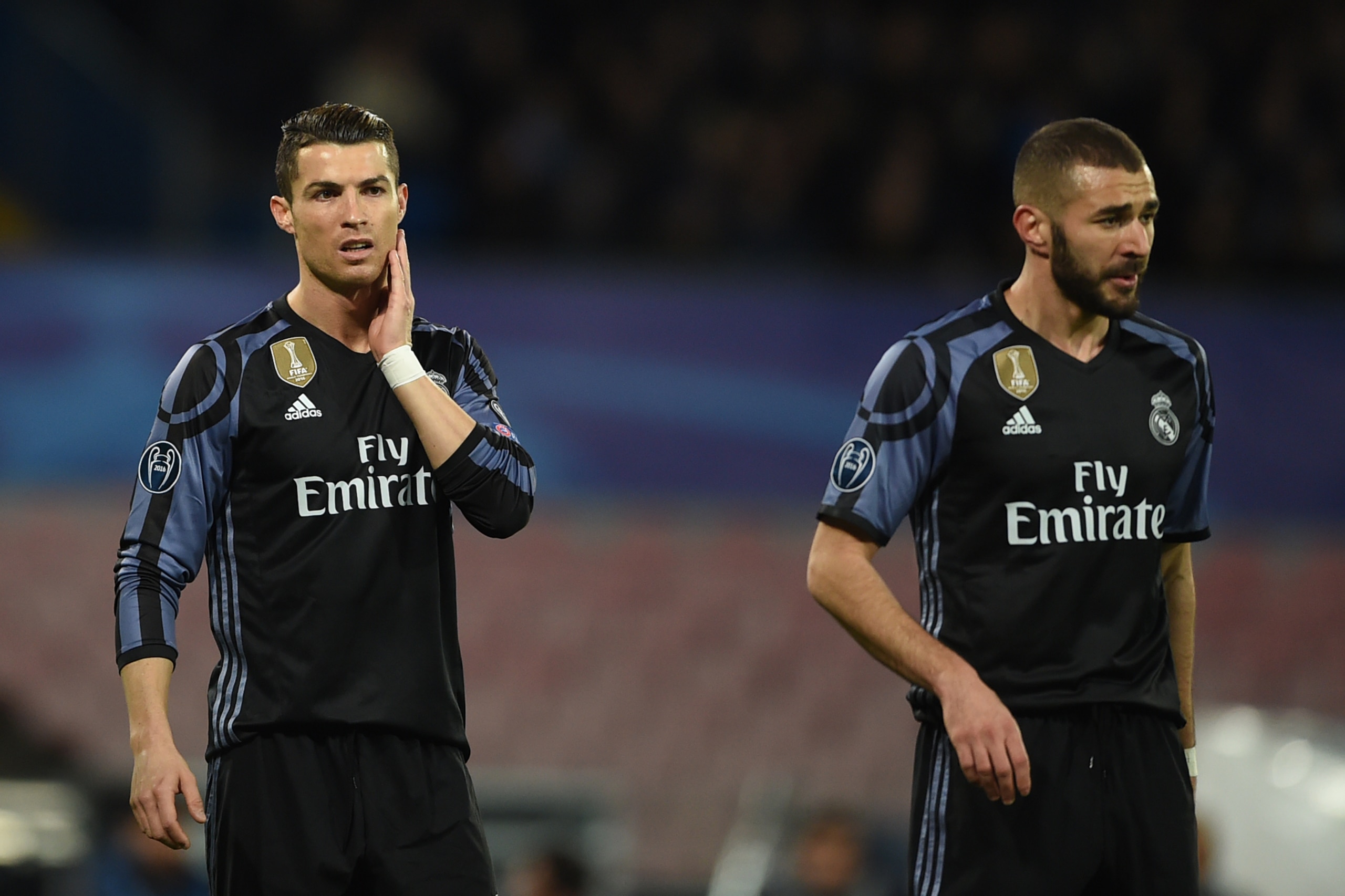Real Madrid's Portuguese forward Cristiano Ronaldo and Real Madrid's French forward Karim Benzema (R) look on during the UEFA Champions League football match SSC Napoli vs Real Madrid on March 7, 2017 at the San Paolo stadium in Naples. Real Madrid won 1- Real Madrid's Portuguese forward Cristiano Ronaldo and Real Madrid's French forward Karim Benzema (R) look on during the UEFA Champions League football match SSC Napoli vs Real Madrid on March 7, 2017 at the San Paolo stadium in Naples. Real Madrid won 1-