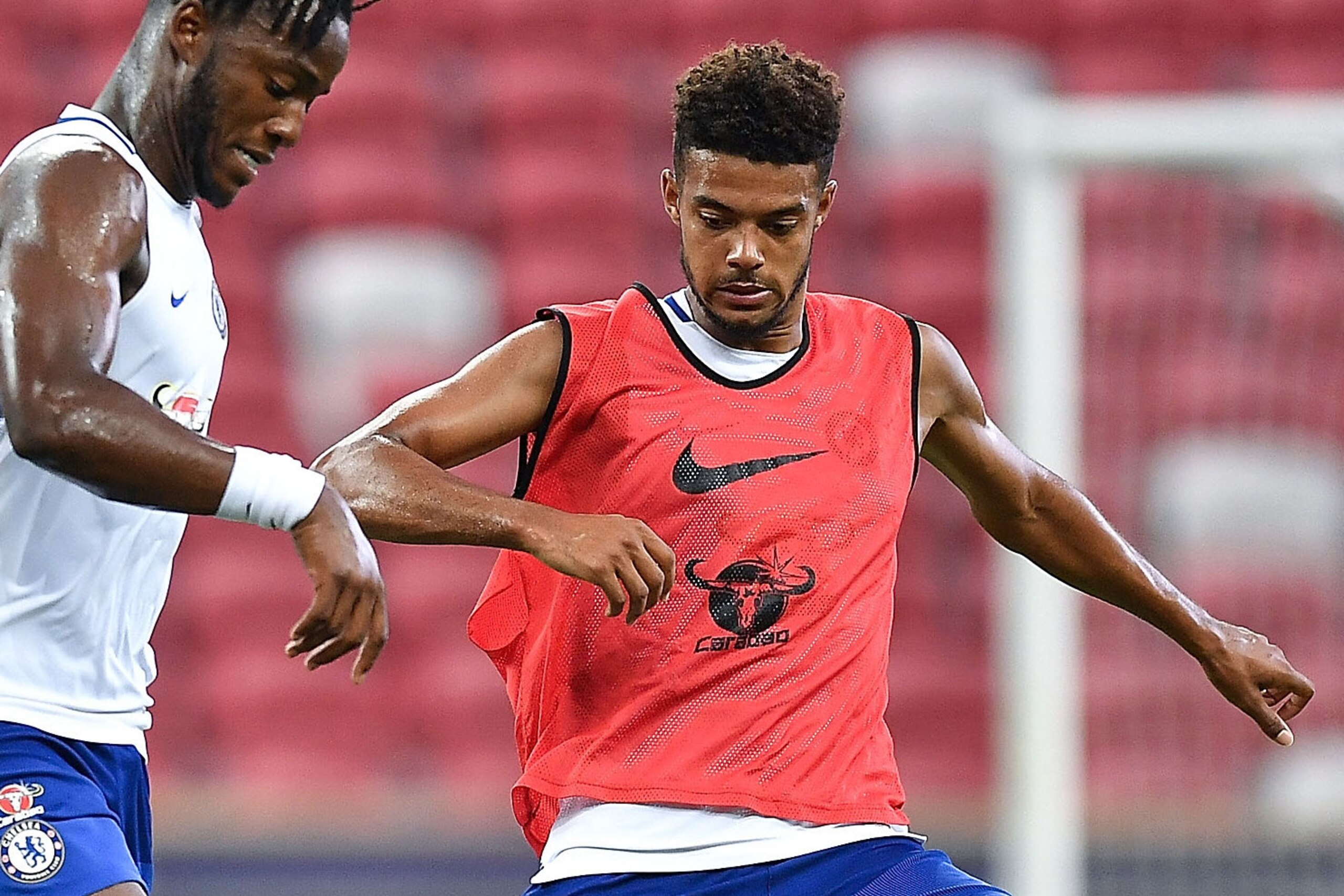 SINGAPORE - JULY 24: Michy Batshuayi and Jake Clarke-Salter of Chelsea FC competes during a Chelsea FC International Champions Cup training session at National Stadium on July 24, 2017 in Singapore.  (Photo by Thananuwat Srirasant/Getty Images  for ICC)