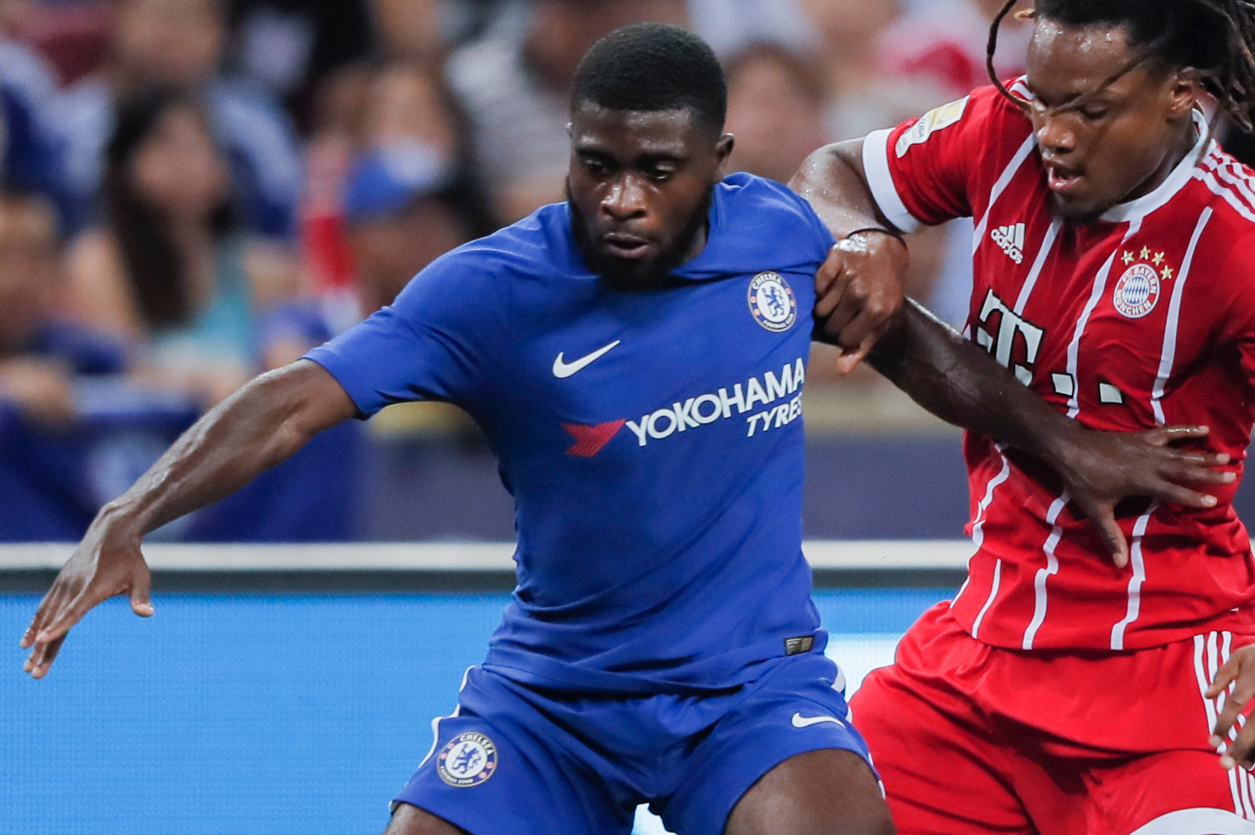 SINGAPORE, SINGAPORE - JULY 25: Bayern Munich Midfielder Renato Sanches (C) fights for the ball with Chelsea Midfielder Jeremie Boga (R) during the International Champions Cup match between Chelsea FC and FC Bayern Munich at National Stadium on July 25, 2