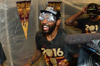 OAKLAND, CA - JUNE 19:  Kyrie Irving #2 of the Cleveland Cavaliers celebrates in the locker room after winning Game Seven of the 2016 NBA Finals against the Golden State Warriors on June 19, 2016 at ORACLE Arena in Oakland, California. NOTE TO USER: User 