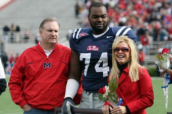 OXFORD, MS - NOVEMBER 28:  Michael Oher #74 of the Ole Miss Rebels stands with his family during senior ceremonies prior to a game against the Mississippi State Bulldogs at Vaught-Hemingway Stadium on November 28, 2008 in Oxford, Mississippi.  (Photo by M