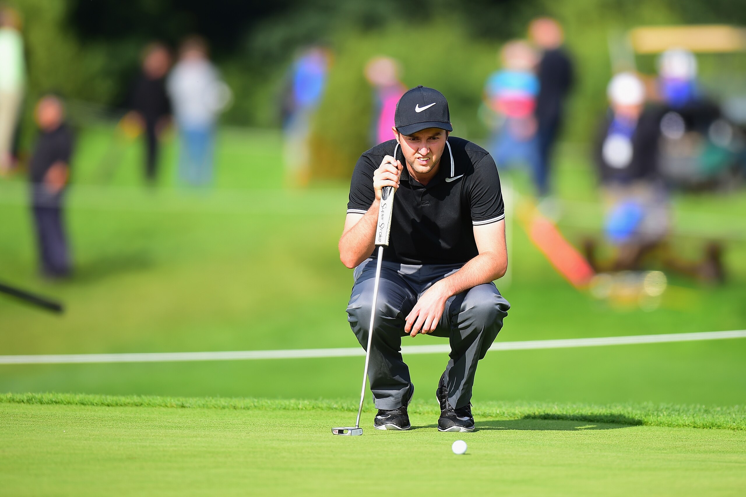HAMBURG, GERMANY - JULY 28: Ashley Chesters of England lines up his putt on the 9th green during the Porsche European Open - Day Two at Green Eagle Golf Course on July 28, 2017 in Hamburg, Germany. (Photo by Tony Marshall/Getty Images) HAMBURG, GERMANY - JULY 28: Ashley Chesters of England lines up his putt on the 9th green during the Porsche European Open - Day Two at Green Eagle Golf Course on July 28, 2017 in Hamburg, Germany. (Photo by Tony Marshall/Getty Images)